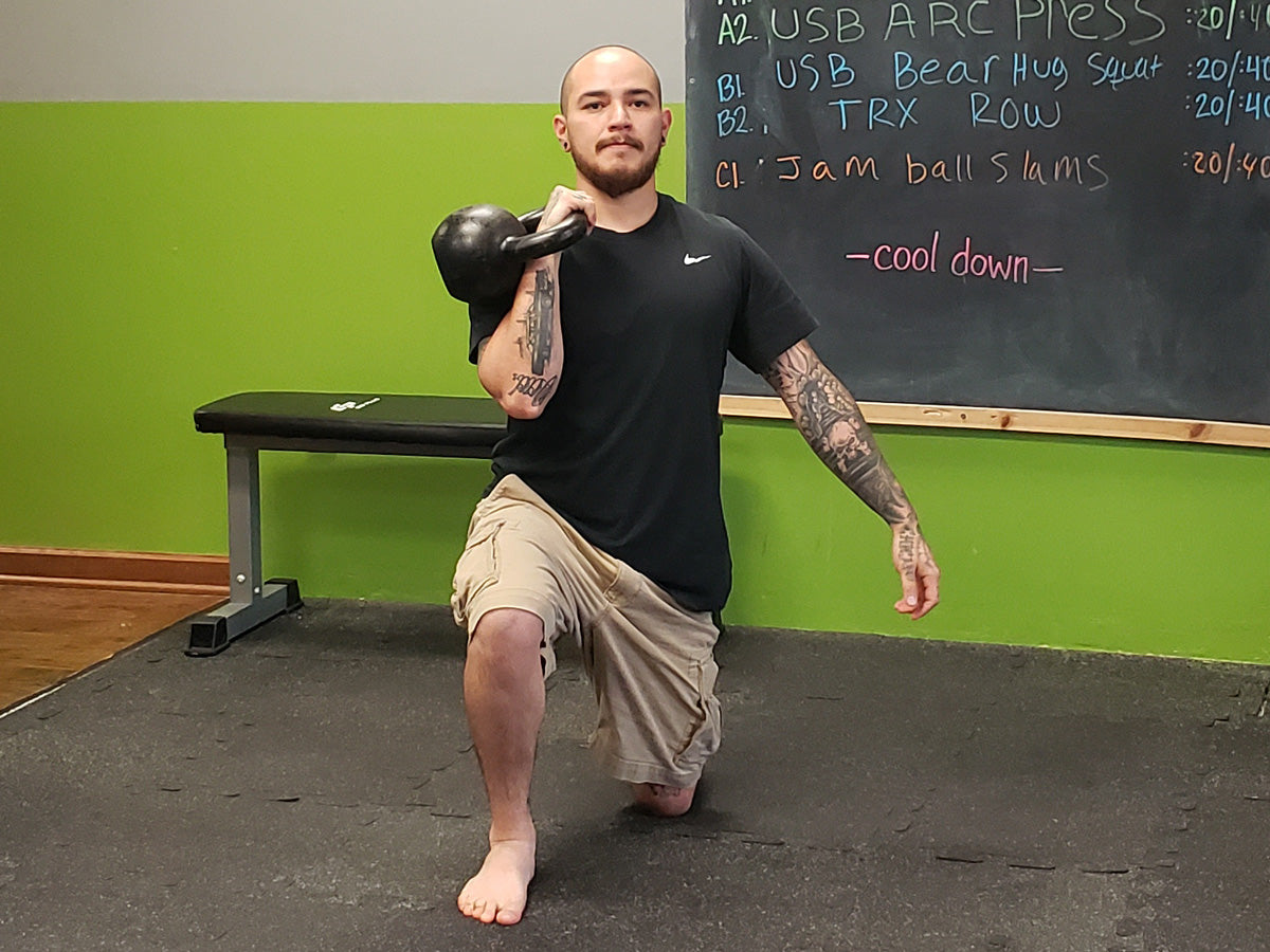 William Sturgeon, RKC-II Performs a half-kneeling kettlebell press